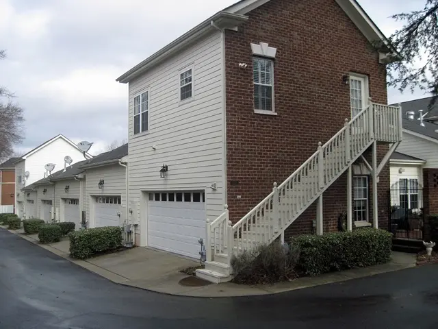 Town homes in Davidson, North Carolina, where the end units have an accessory dwelling unit above the garage, reached by an outside stair